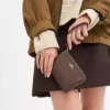 Muñequera COACH
